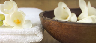 Towels with bowl of flowers